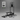 Black exercise machine with accessories on a gray background