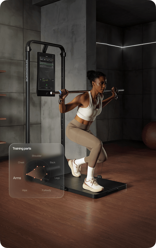 Woman exercising on a pull-up bar in a gym setting