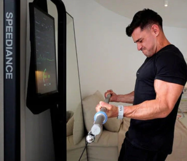 Rob Lipsett doing barbell exercise on Speediance Gym Monster 2