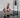 An individual crouched in a squatted position