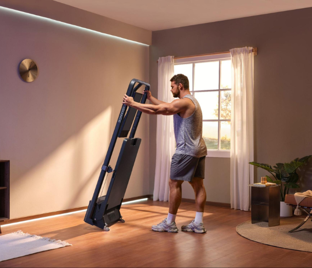 Man setting up Speediance Gym Monster 2