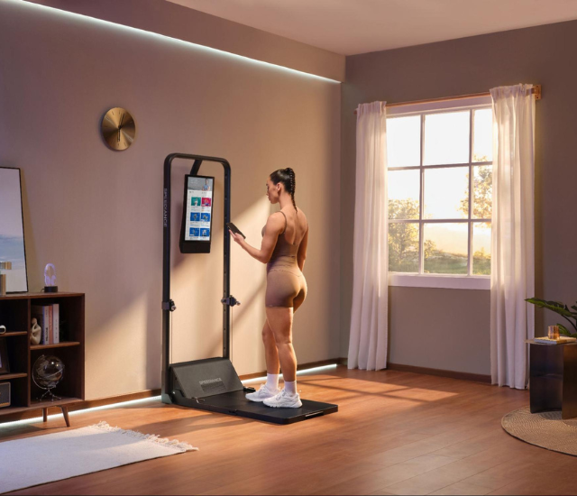 Woman setting up the Speediance Gym Monster 2