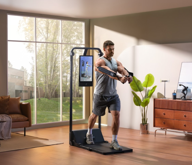A man uses the Speediance Gym Monster 2 in his home gym