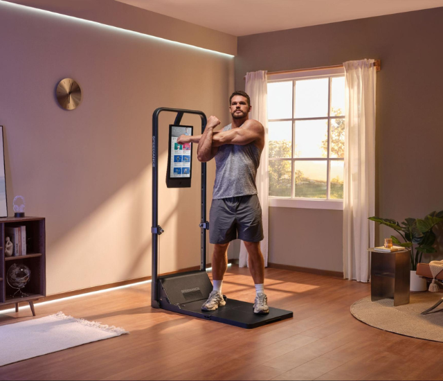 Man warming up for chest workout on Speediance Gym Monster 2
