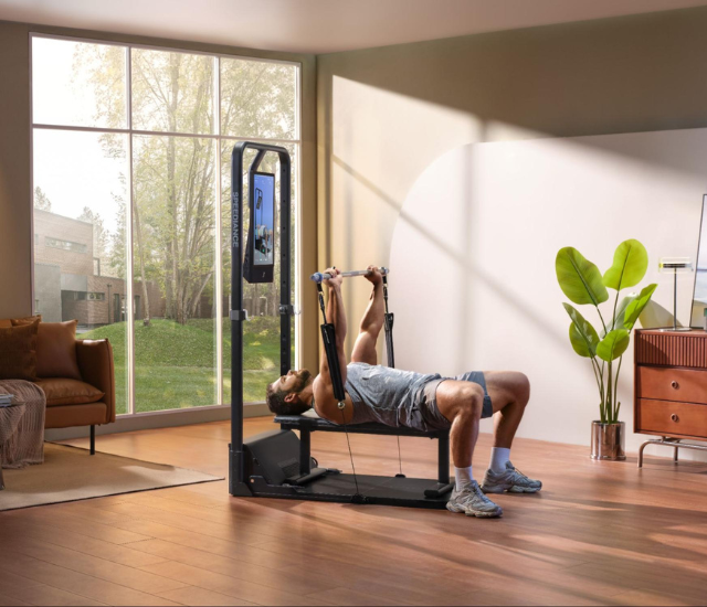 Man performing close grip bench press on Speediance Gym Monster 2