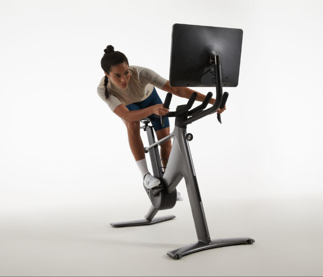 Woman indoor cycling on the Speediance Velonix