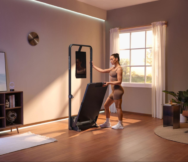 Woman setting up cable machine