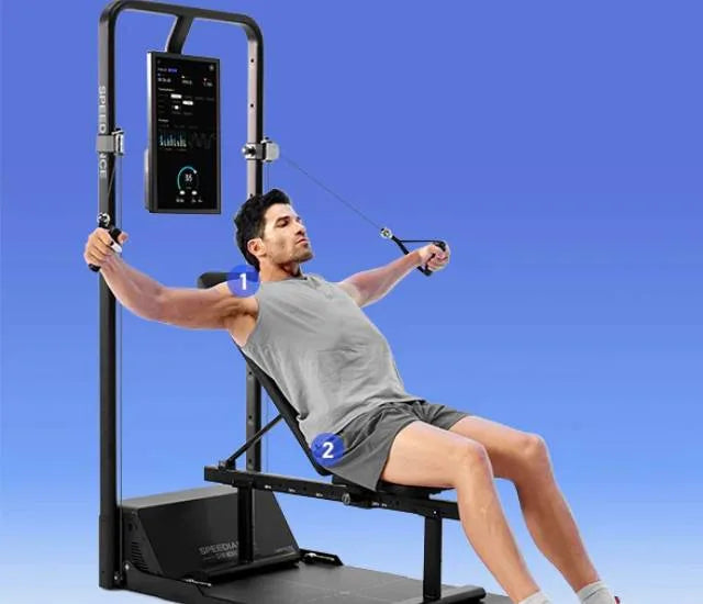 Man in gray tank top pulling cable handles on a black Speediance machine