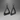 Two black metal handles on a gradient gray background