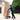 A person is using a hand truck to transport a large, beige box that has the word 'SPEEDIANCE' printed on it.