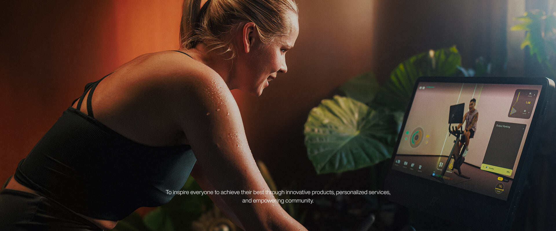 Woman using a tablet with a fitness app on a dark background