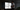 Person standing in front of a large display screen with multiple windows open, in a dark room.