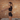 Woman exercising with fitness metrics displayed on a brick wall background