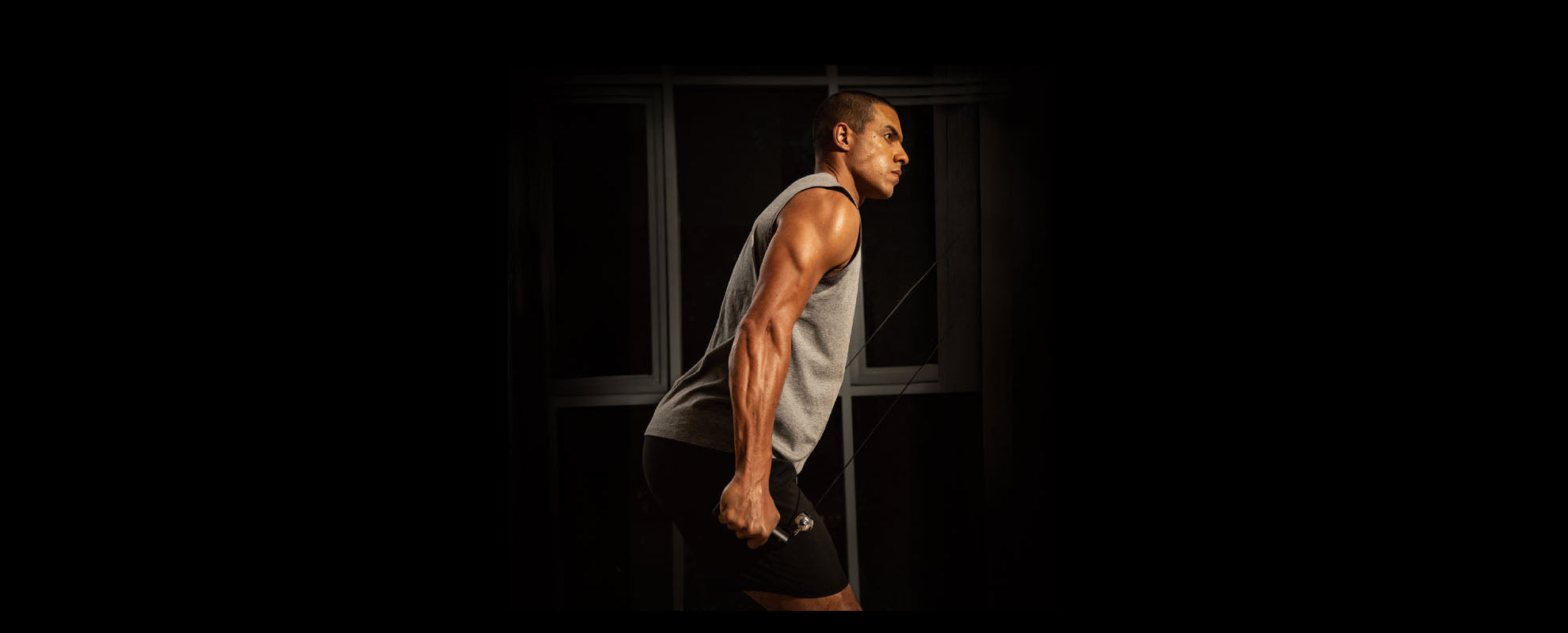 a man showing how to use Speediance equipment