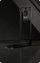 Black exercise machine with digital display on a dark floor